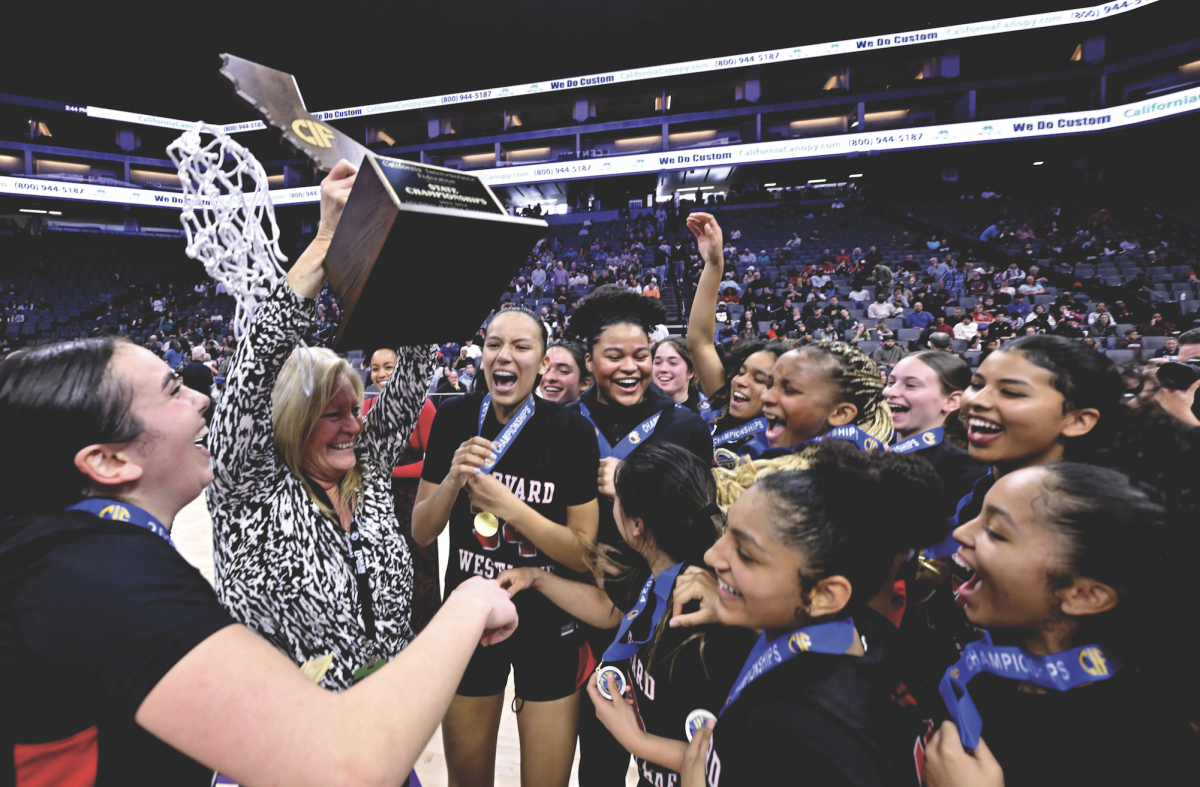 Former Program Head of the Girls' Basketball Program Melissa Hearlihy raises the 2024 CIF Girls' Basketball State Championship trophy after a 60-45 win over Colfax High School from Northern California. (Photo by Keith Birmingham, Orange County Register/ SCNG) 